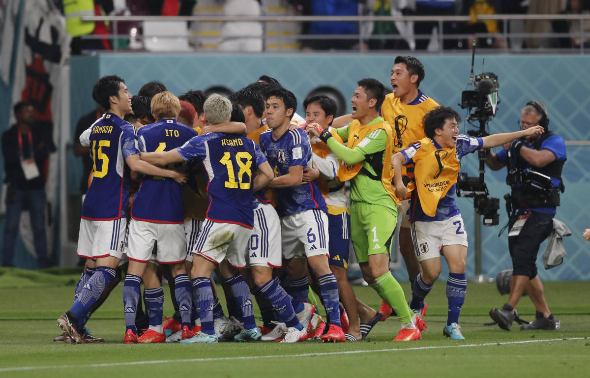 Players of Japan pictured celebrating during their 2-1 win over Germany at the 2022 FIFA World Cup in Qatar